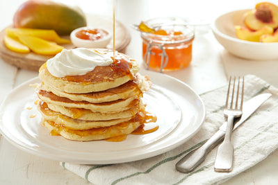 Orange scented Pancakes with Galloping Cows Peach Melody Spread, and Greek Yogurt